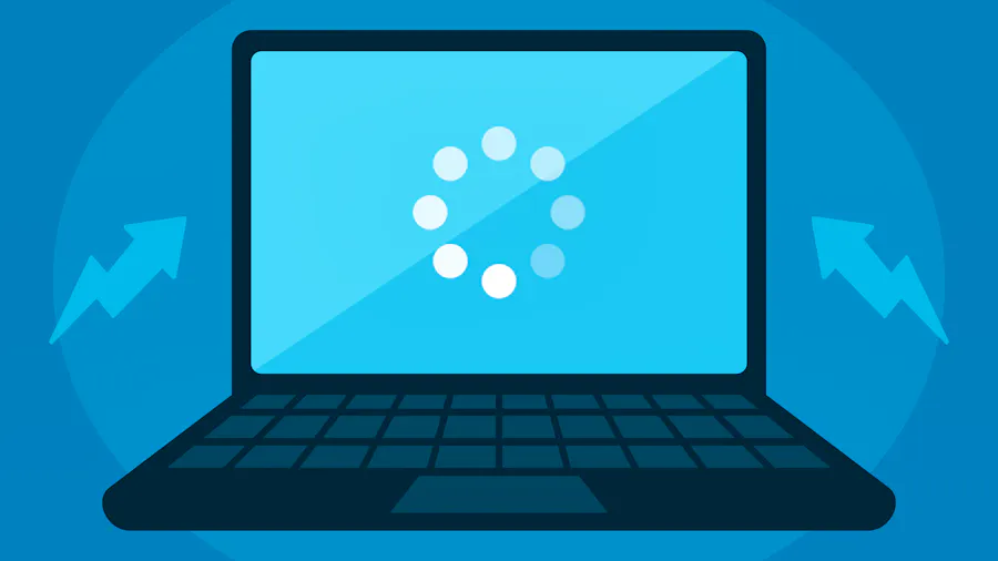 A laptop displaying a loading icon.